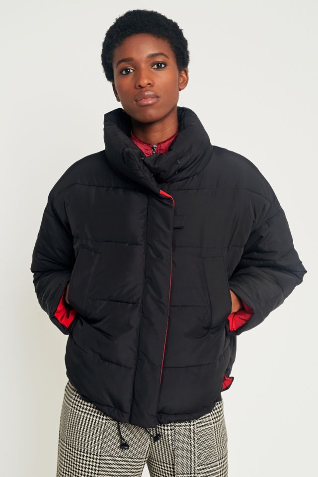 Black puffer jacket shop with red inside