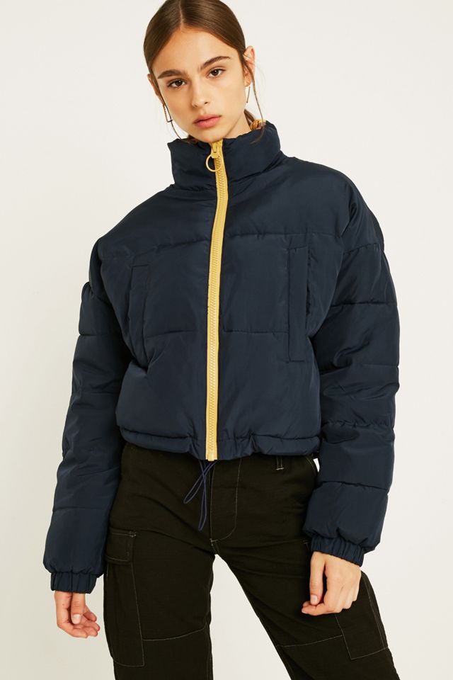 Urban Outfitters – Steppjacke „Krissy“ mit kariertem Futter