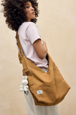 BDG Penny Canvas V Sling Bag - Brass at Urban Outfitters