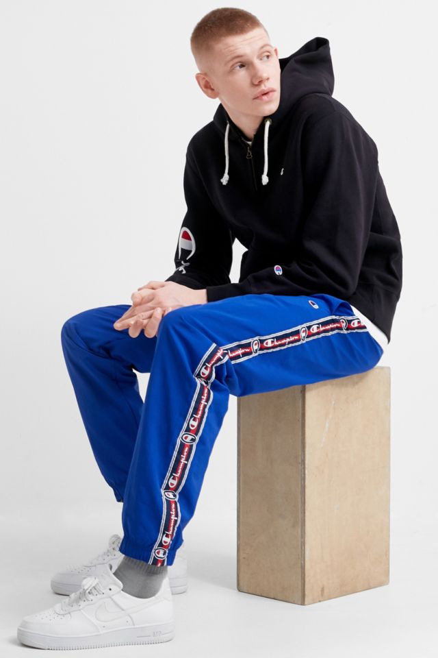 Champion logo hot sale tape sweatpants