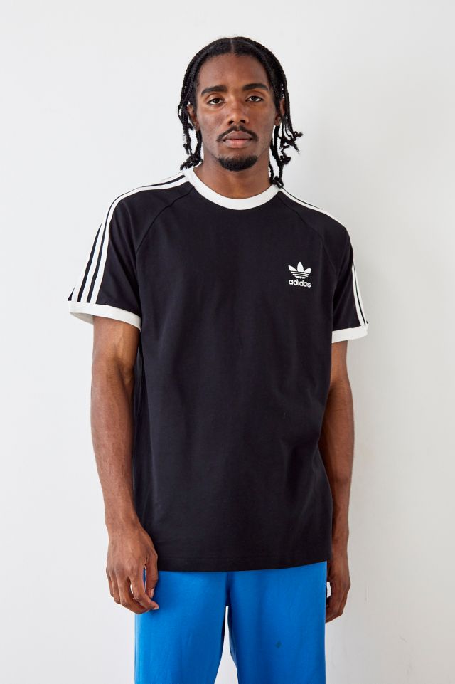 ~ lado Negociar rueda adidas camiseta negra de 3 rayas | Urban Outfitters ES