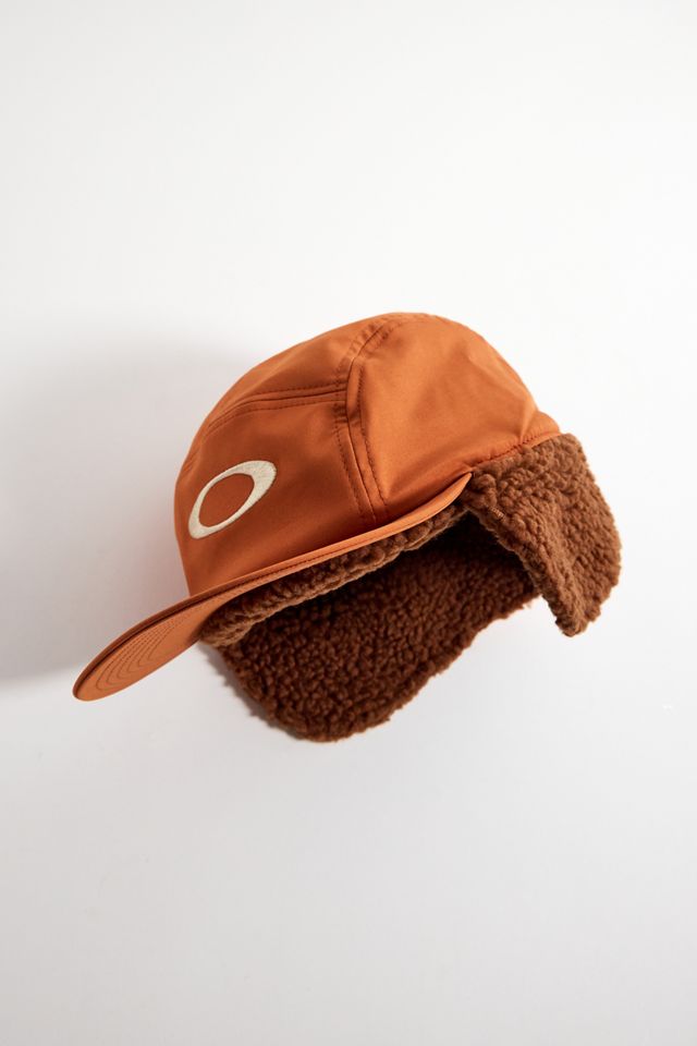 Oakley Orange Rykkin Flap Cap | Urban Outfitters UK