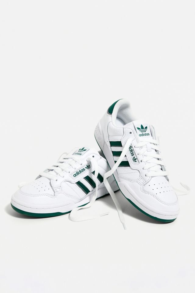 Adidas white shoes shop with green stripes