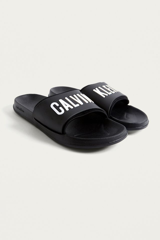 Calvin Klein Black Logo Pool Sliders | Urban Outfitters UK