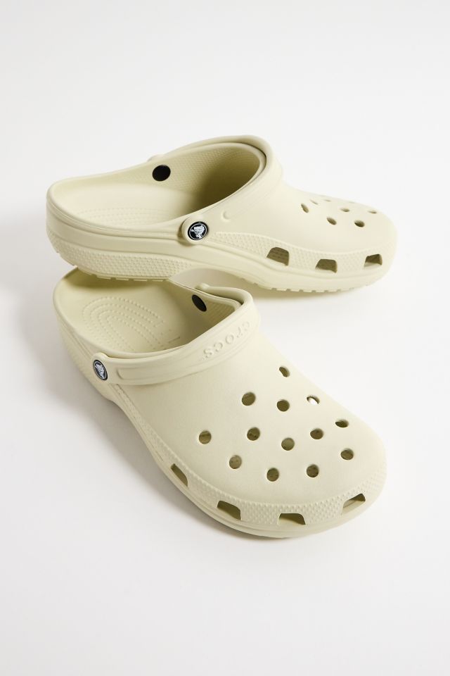 Crocs Bone Classic Clogs | Urban Outfitters UK