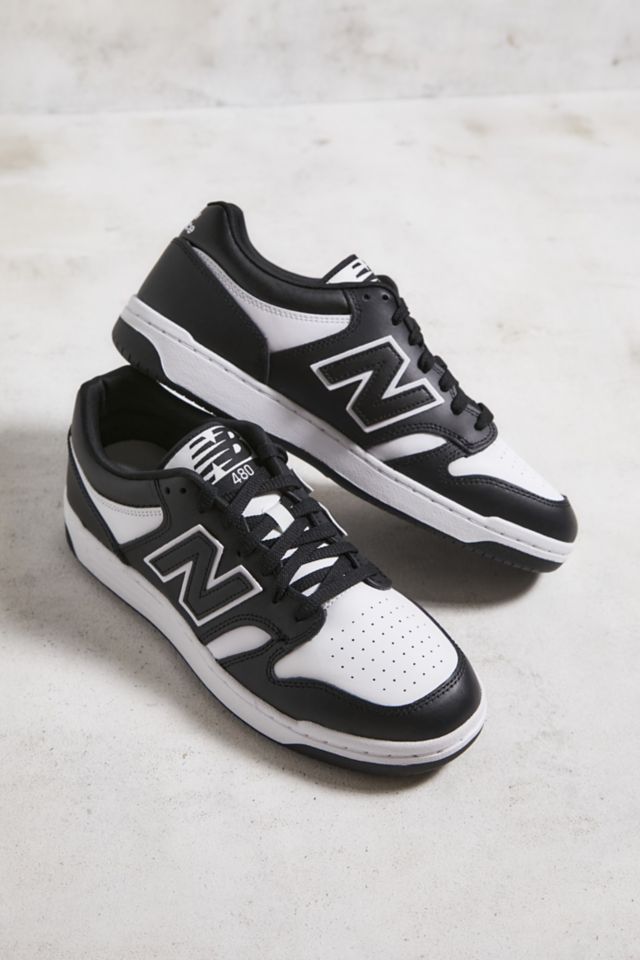 New balance white store and black trainers