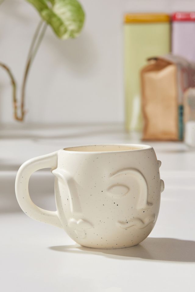 Tasse en céramique motif visage