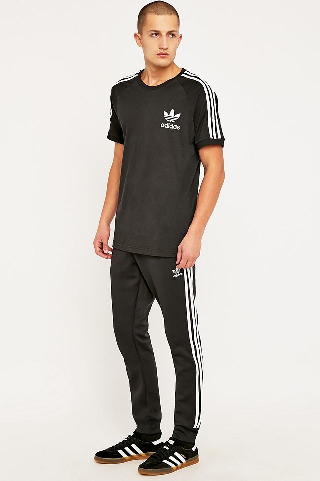 adidas Superstar Tracksuit Bottoms in Black | Urban Outfitters UK