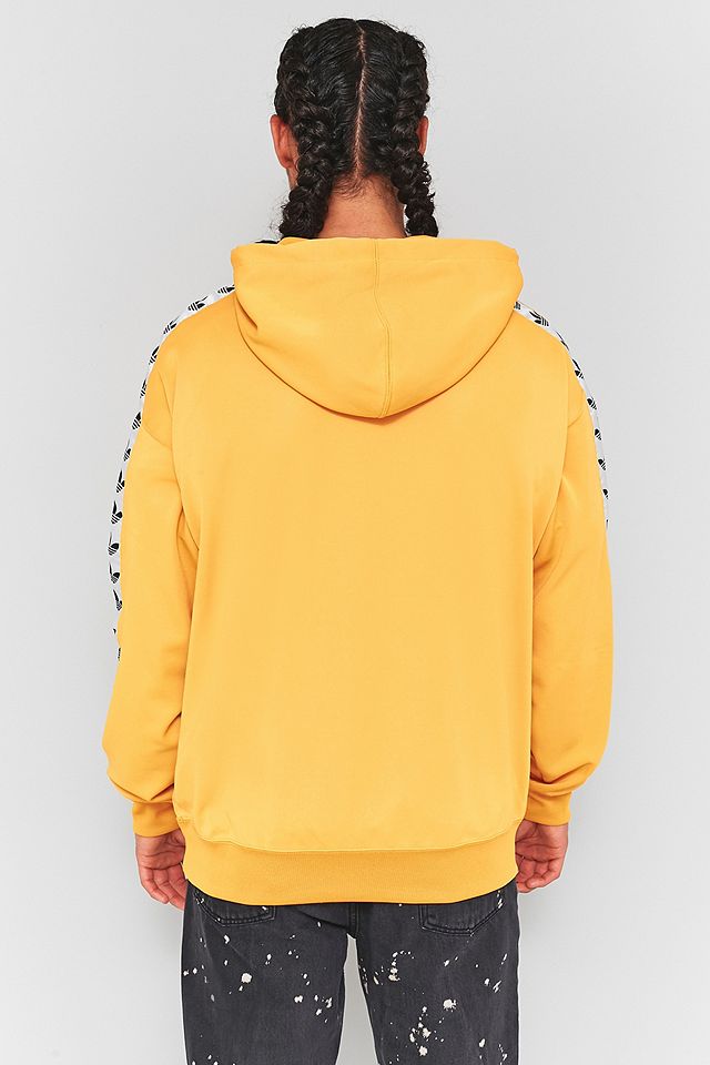 maksimere svinekød flåde adidas TNT Yellow and White Taped Hoodie | Urban Outfitters UK