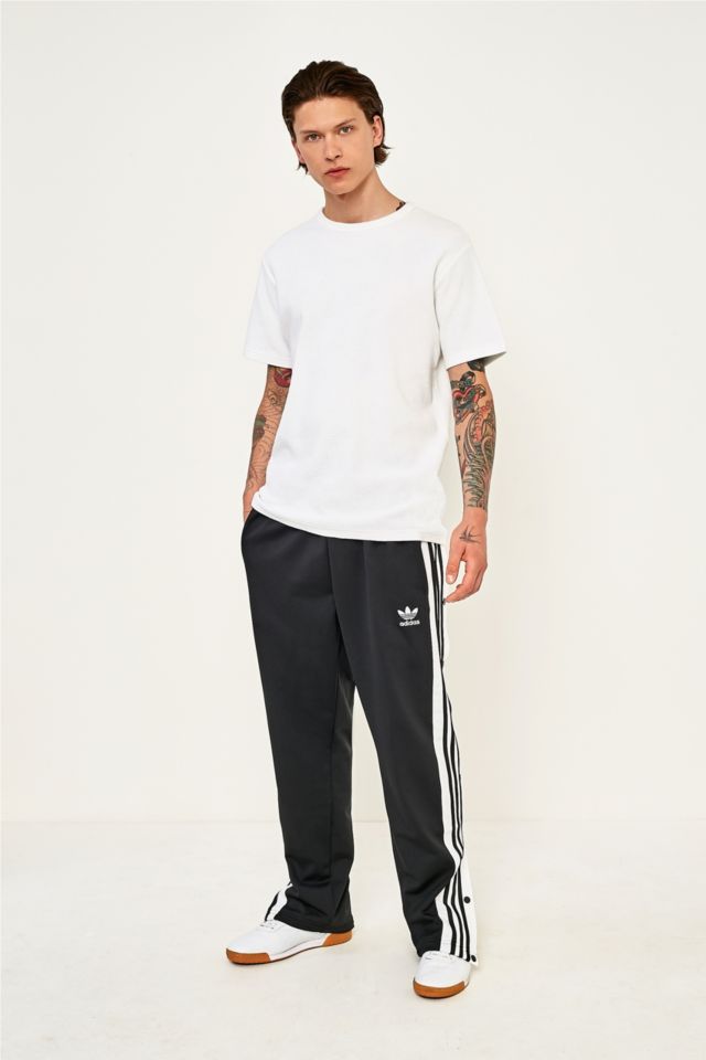 Adidas trousers best sale with poppers