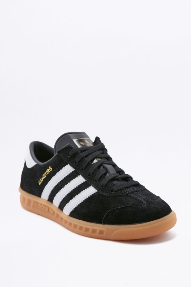 Adidas black shoes shop with brown sole