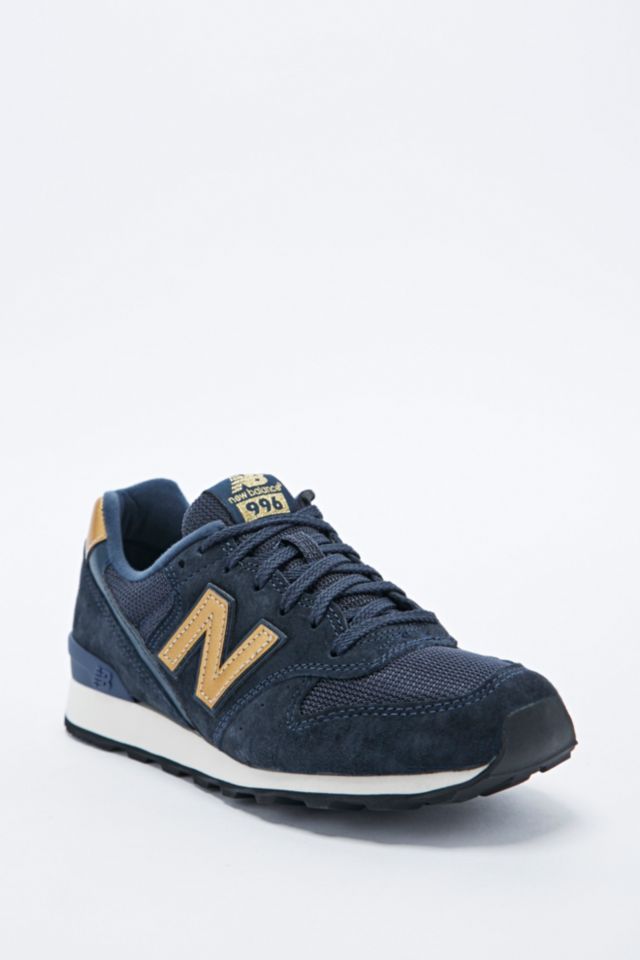New Balance 996 Trainers in Navy and Urban Outfitters UK